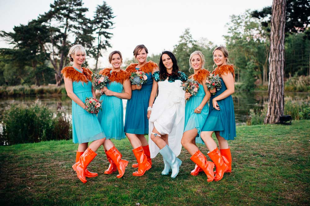 Wedding guests posing in stylish wellies